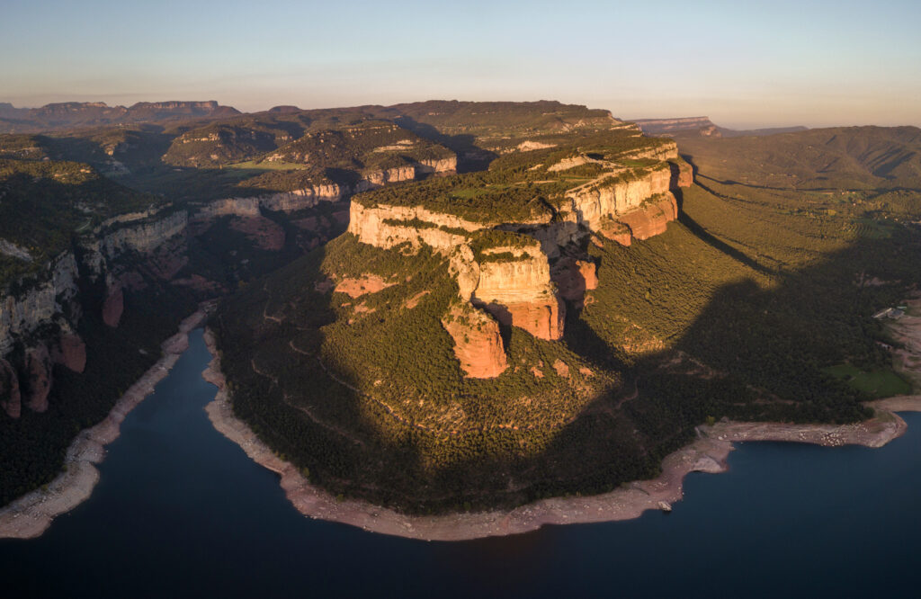 Aerial View Of Colorful Sheer Cliffs Above Sau Reservoir Near Tavertet In Catalonia, Spain