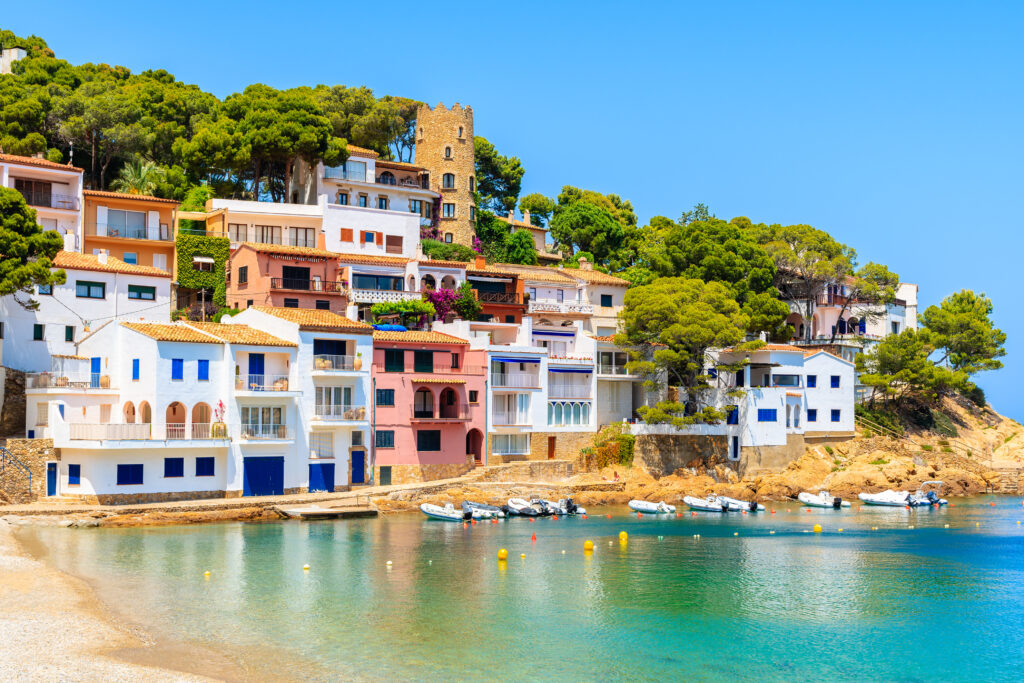 View Of Colorful Houses In Sea Bay With Beach In Sa Tuna Coastal